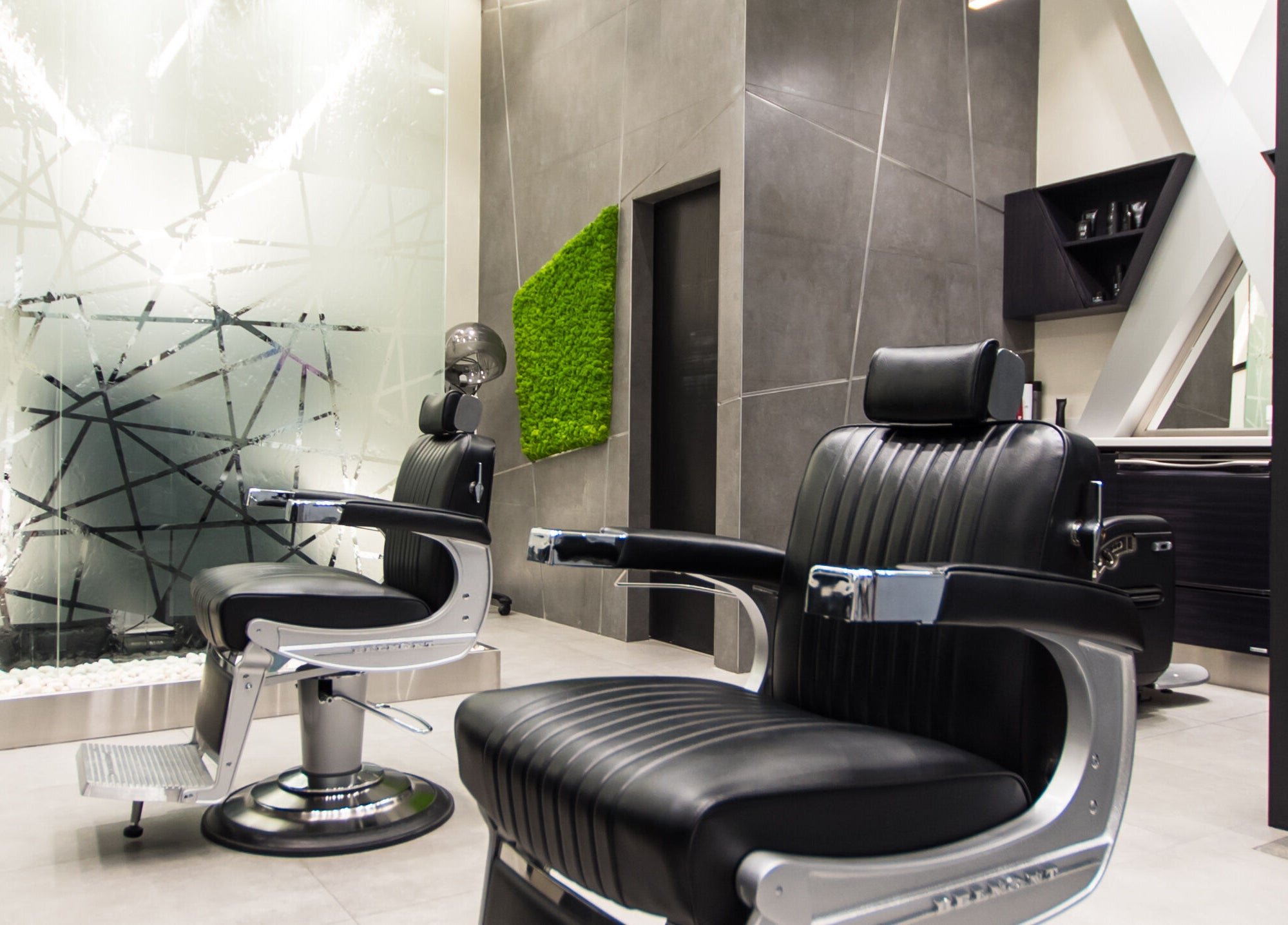 Modern salon chairs at X Hair Lounge - City Center Mirdif, Dubai, AE offering luxury styling services.