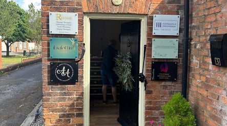 Entrance of Wax and Go, Bawtry Doncaster, England, GB with visible signage on a brick wall.