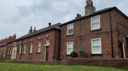 Exterior of Wax and Go in historic brick building, Bawtry Doncaster, England, GB.