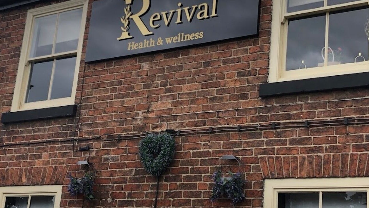 Rustic exterior of Wax and Go at Bawtry Doncaster, England, GB with a vintage sign.