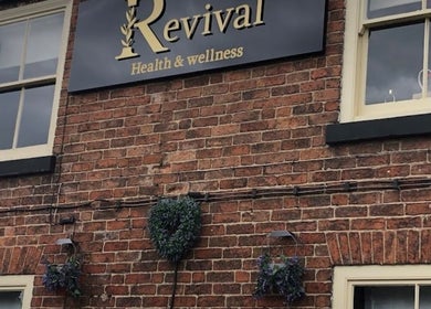 Rustic exterior of Wax and Go at Bawtry Doncaster, England, GB with a vintage sign.