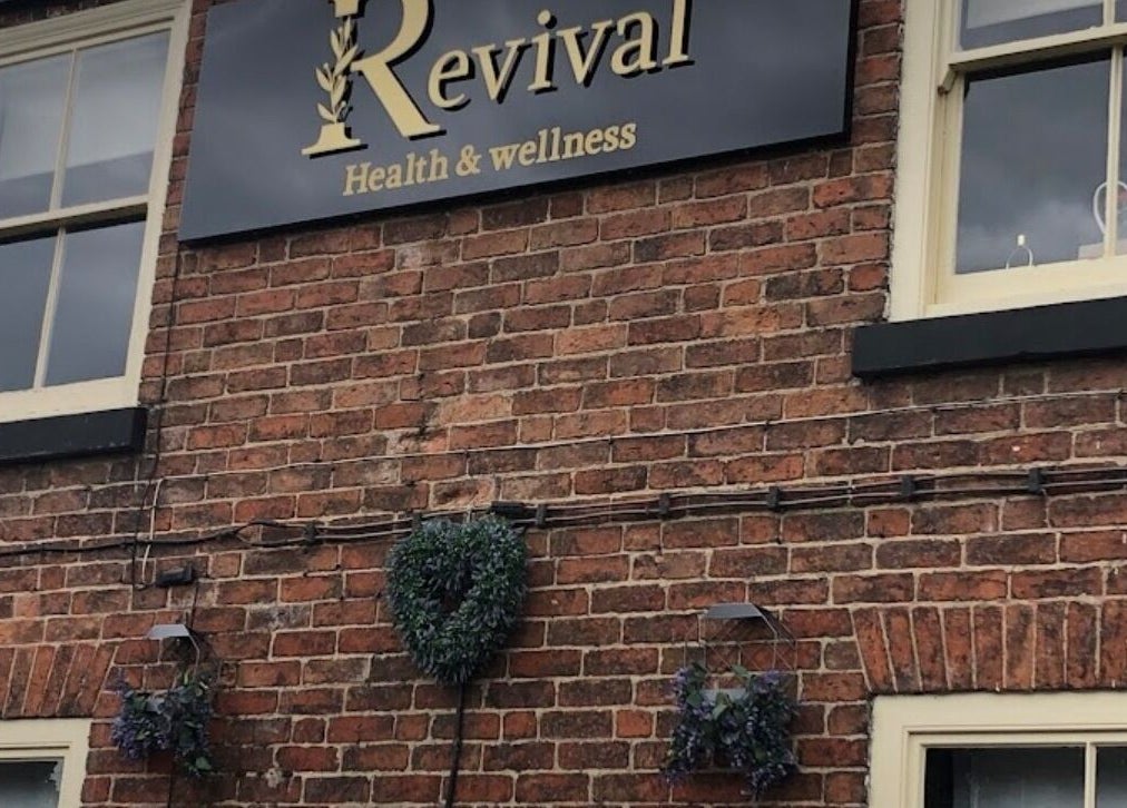 Rustic exterior of Wax and Go at Bawtry Doncaster, England, GB with a vintage sign.