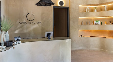 Calming reception area of Aura Head Spa | Ridgewood, New Jersey, US with elegant decor and ambient lighting.