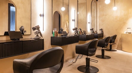 Elegant salon space at Aura Head Spa | Ridgewood in Ridgewood, New Jersey, US, featuring stylish black chairs.