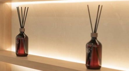 Elegant diffuser bottles on shelf at Jo:Hwa Hair & Living, Singapore, Singapore, SG, enhancing the tranquil ambiance.