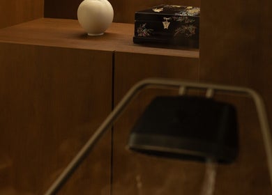 Minimalist decor at Jo:Hwa Hair & Living, Singapore, showcasing a white vase on a wooden shelf.