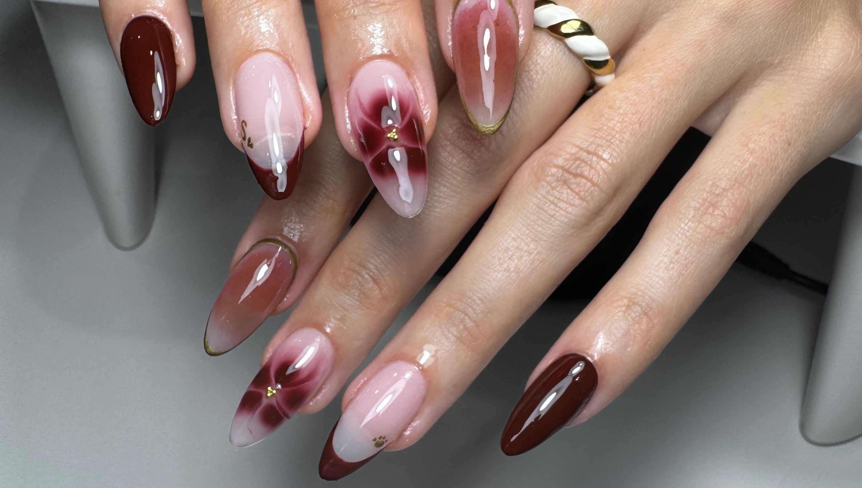 Stylish nail art featuring burgundy and pink tones by Gel Lane Co. in Southport, Queensland, AU.