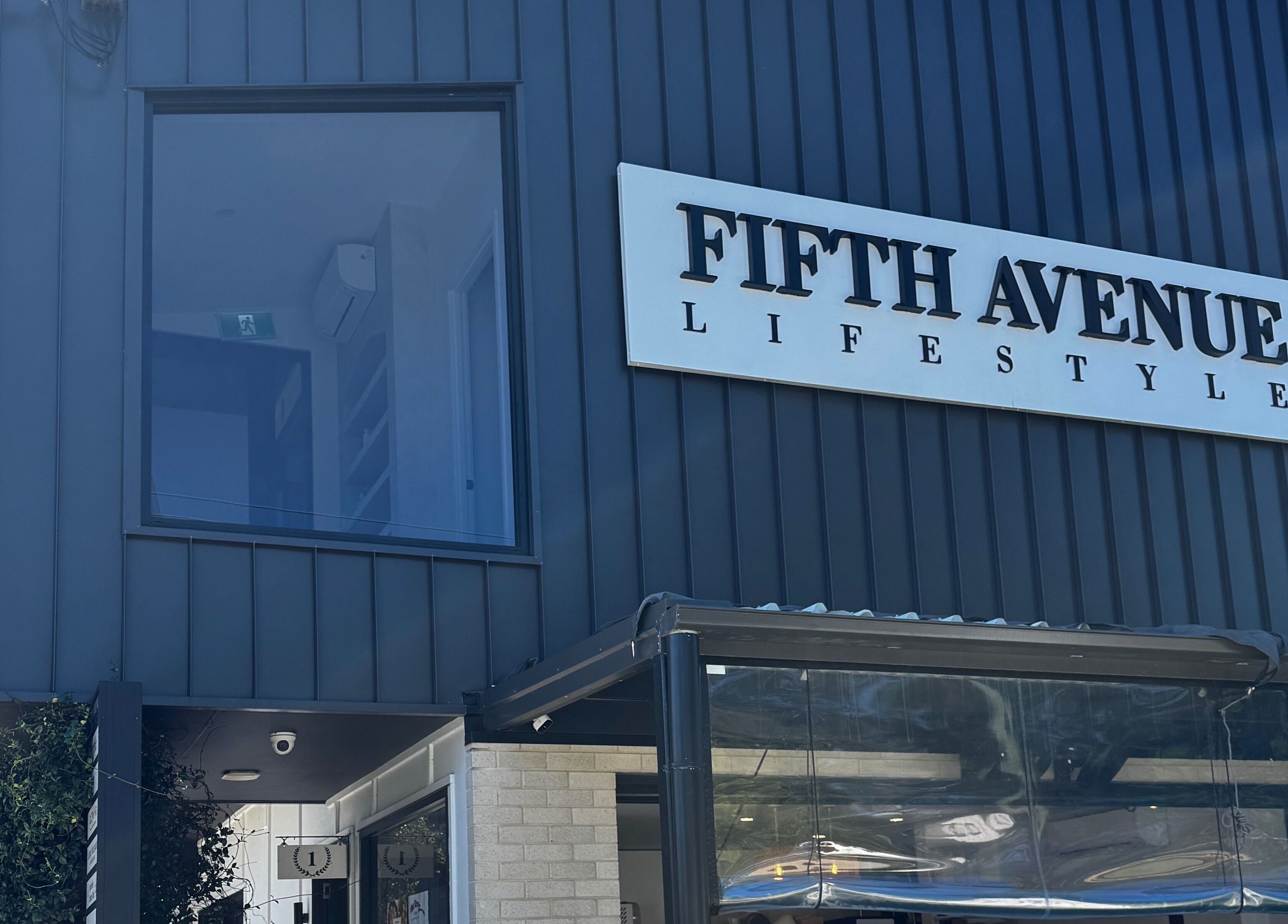 Gel Lane Co. venue exterior in Southport, Queensland, AU, featuring sleek, dark modern facade.