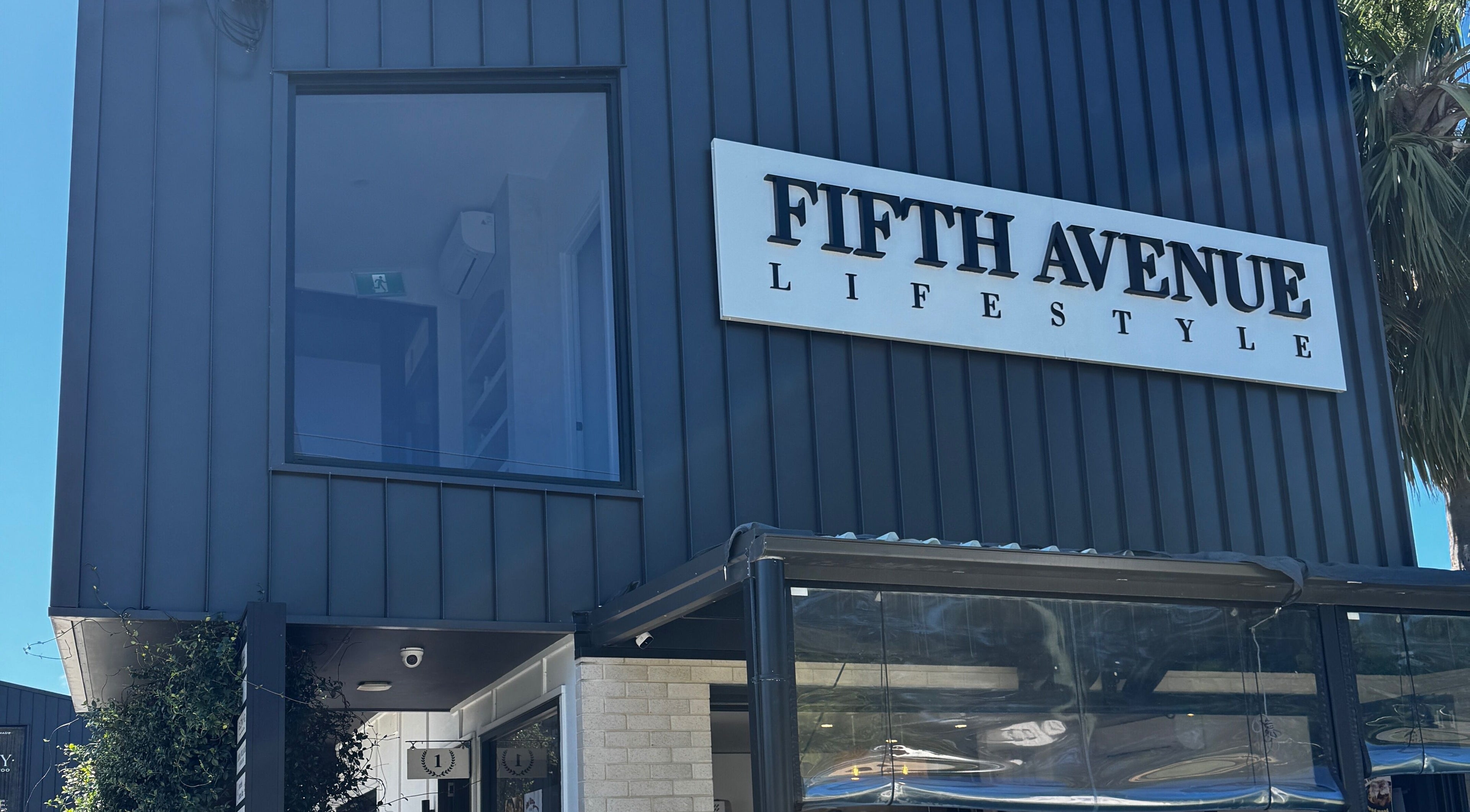 Gel Lane Co. venue exterior in Southport, Queensland, AU, featuring sleek, dark modern facade.