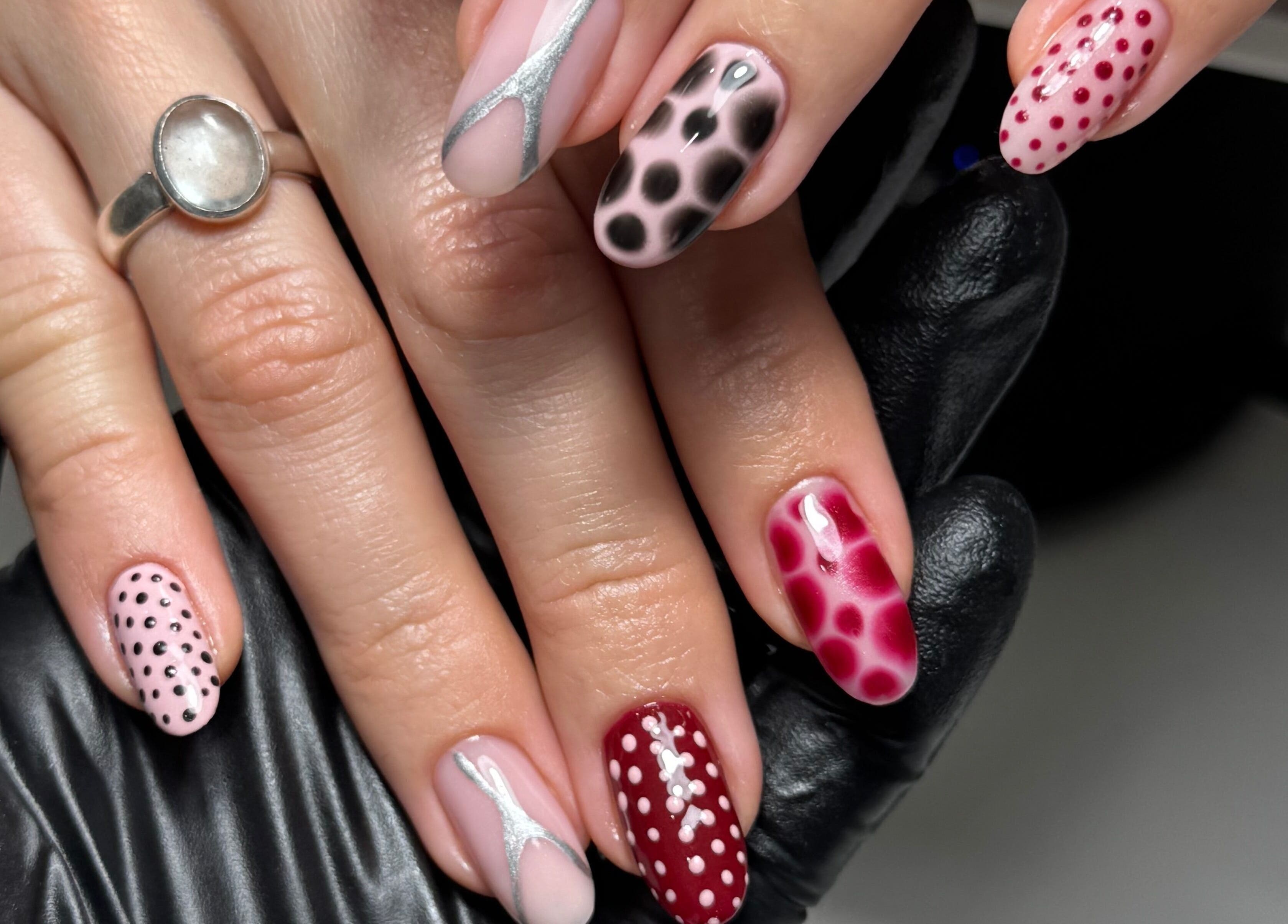 Artistic nail designs at Gel Lane Co. in Southport, Queensland, AU, showcasing intricate patterns and colors.