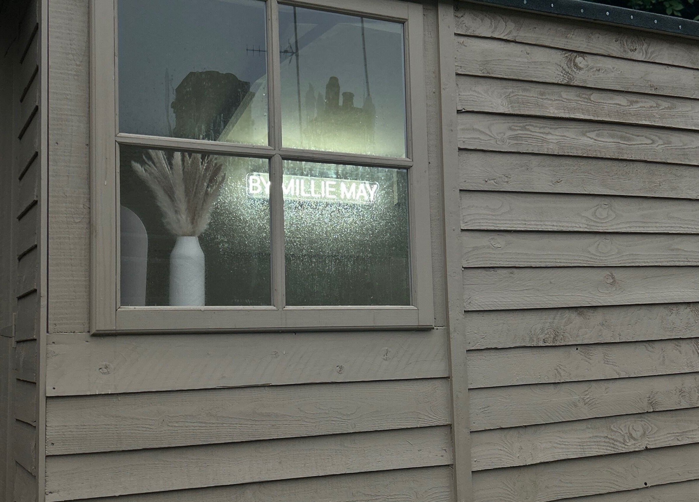 ByMillieMay exterior view with window and pampas grass, Hemel Hempstead, England, GB.