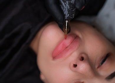 Close-up of lip tattoo in progress at DivaLook Academy Inc., Montréal, Québec, CA.
