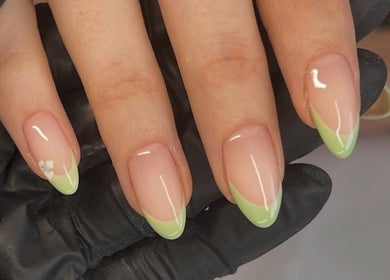 Stylish green French manicure at The Hair Duo in Airdrie, Scotland, GB. Perfect nail care and design.