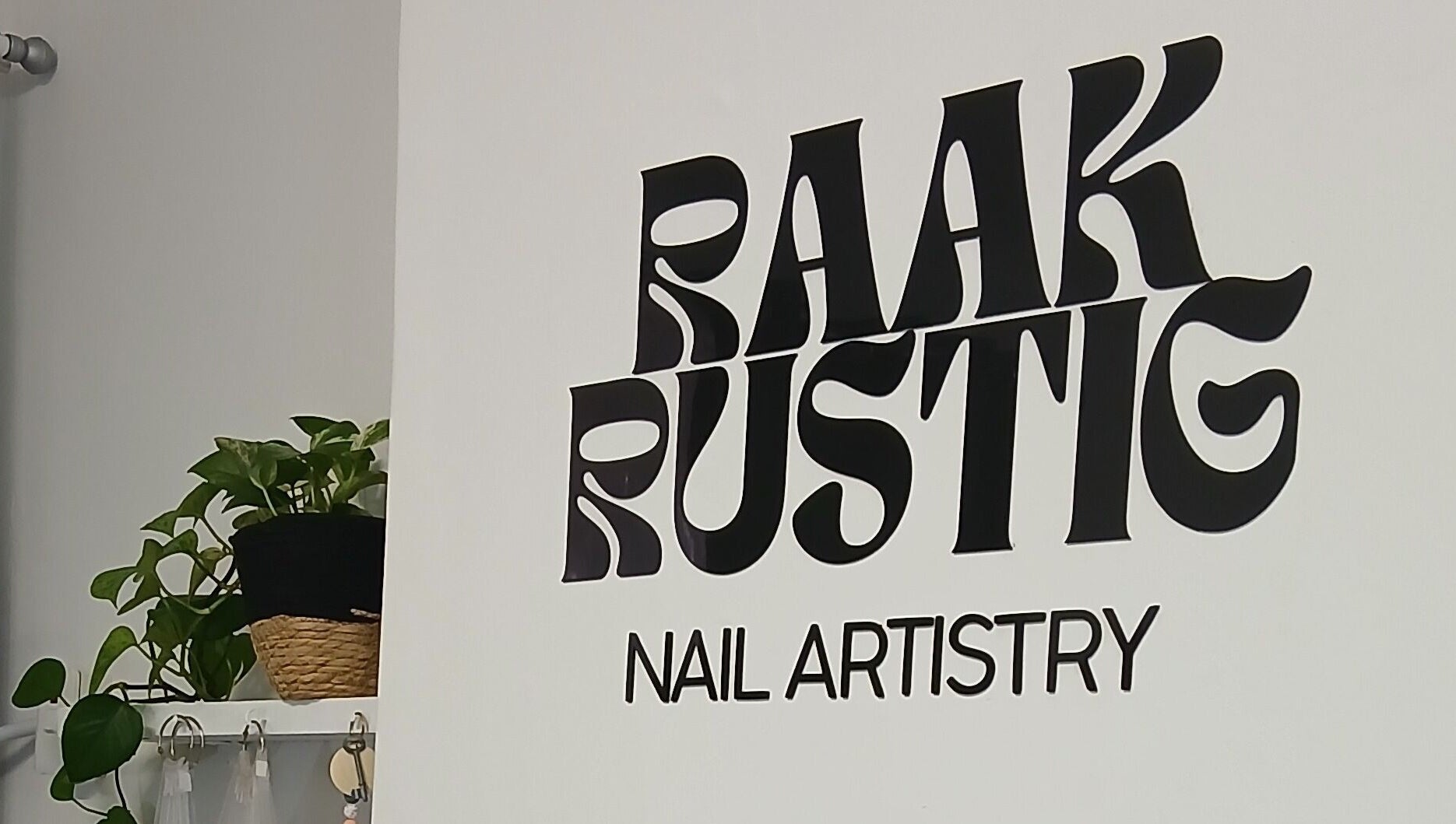 Raak Rustig Nails logo on a white wall, Jeffreys Bay, Eastern Cape, ZA.