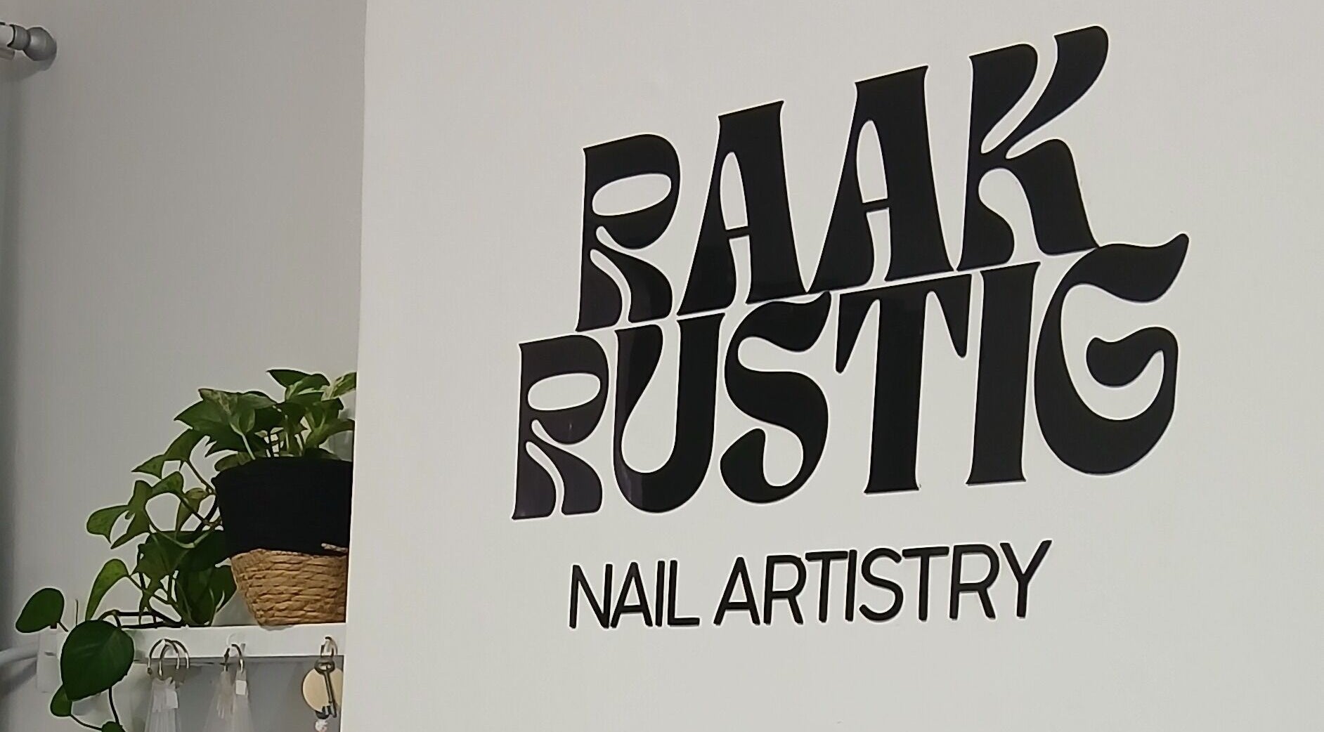 Raak Rustig Nails logo on a white wall, Jeffreys Bay, Eastern Cape, ZA.