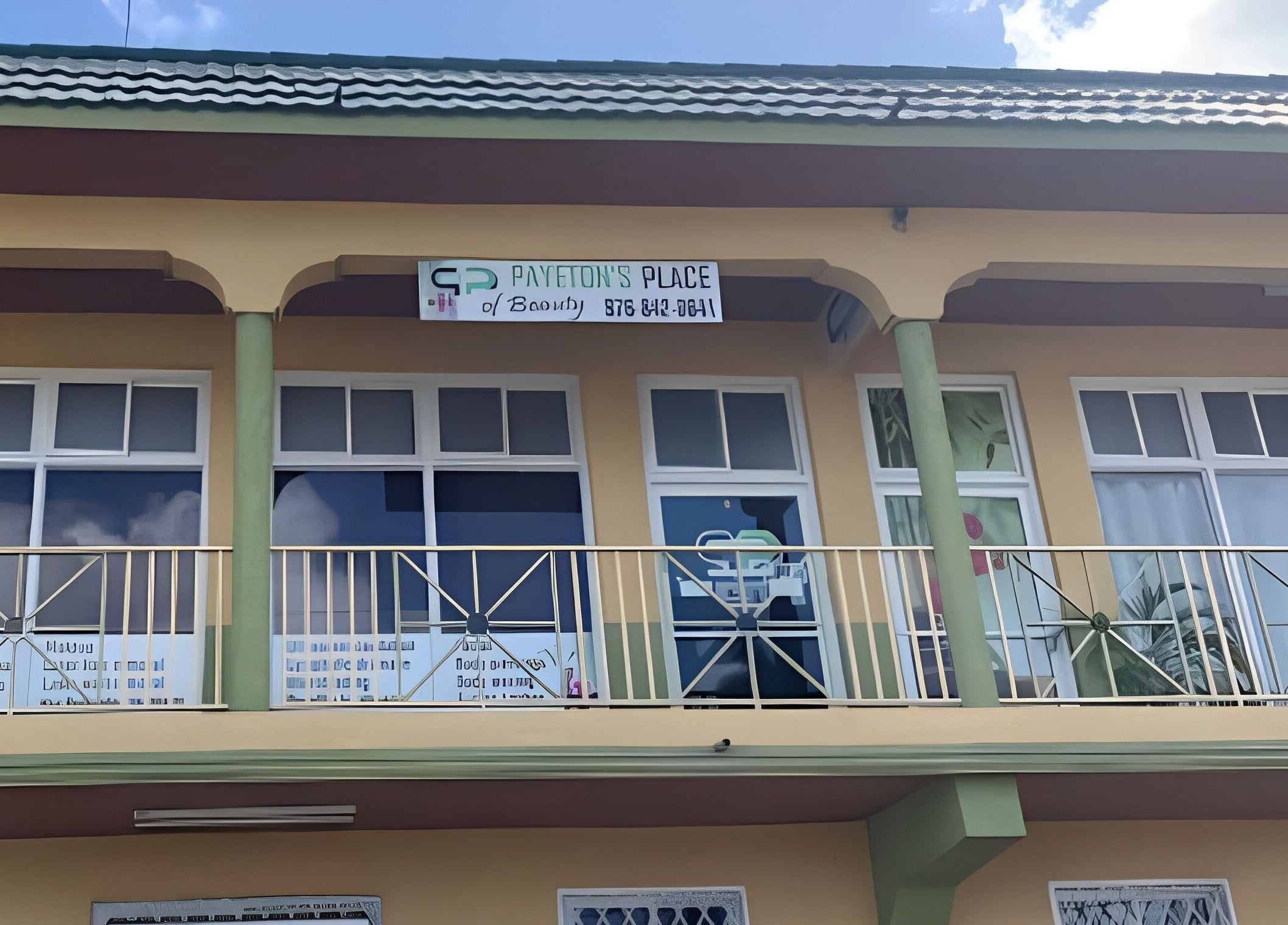 Facade of Payeton's Place of Beauty and Decor Studio in Montego Bay, St. James Parish, JM under a blue sky.