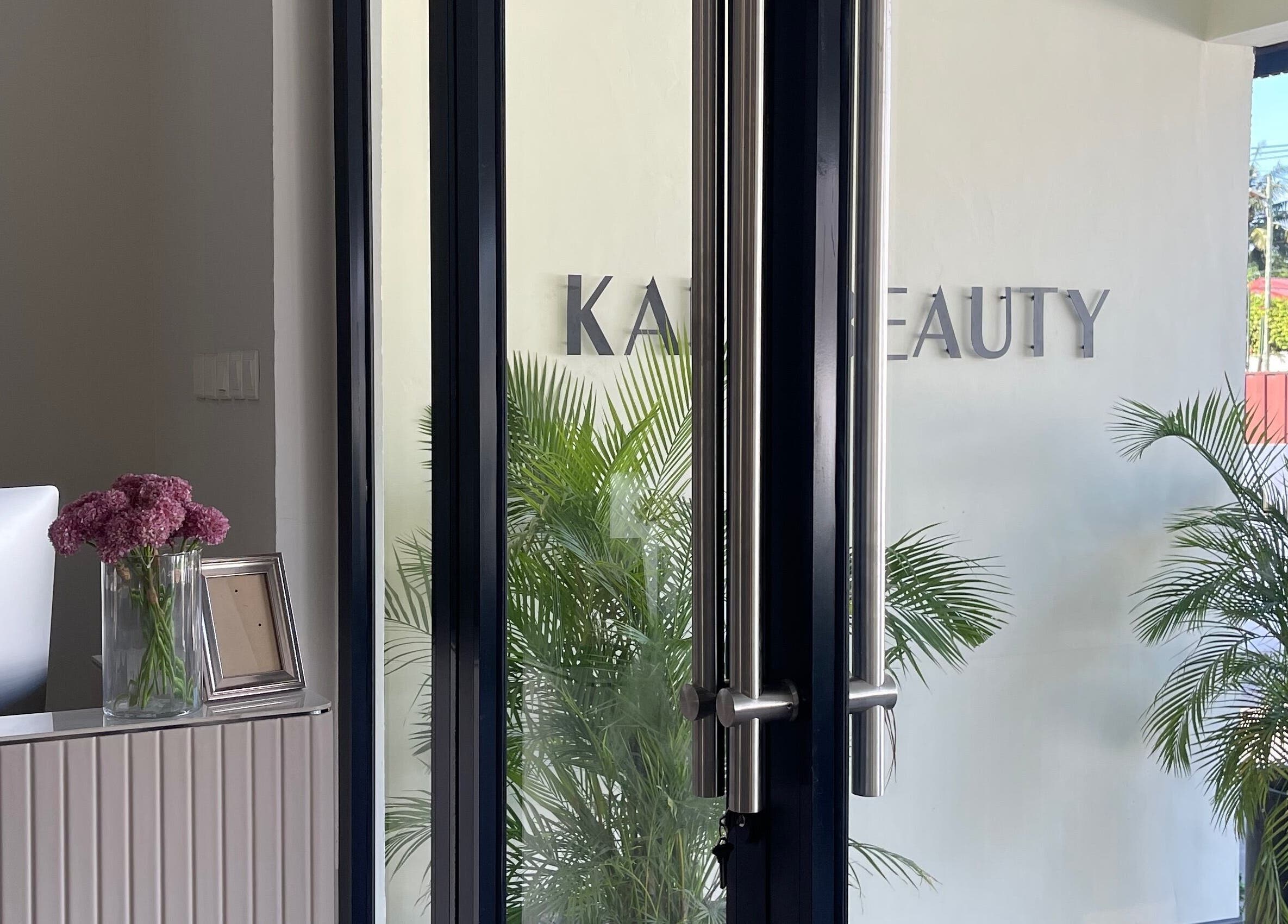 Entrance to Kai Beauty Studio in Accra, Greater Accra Region, GH with lush plants and a welcoming decor.