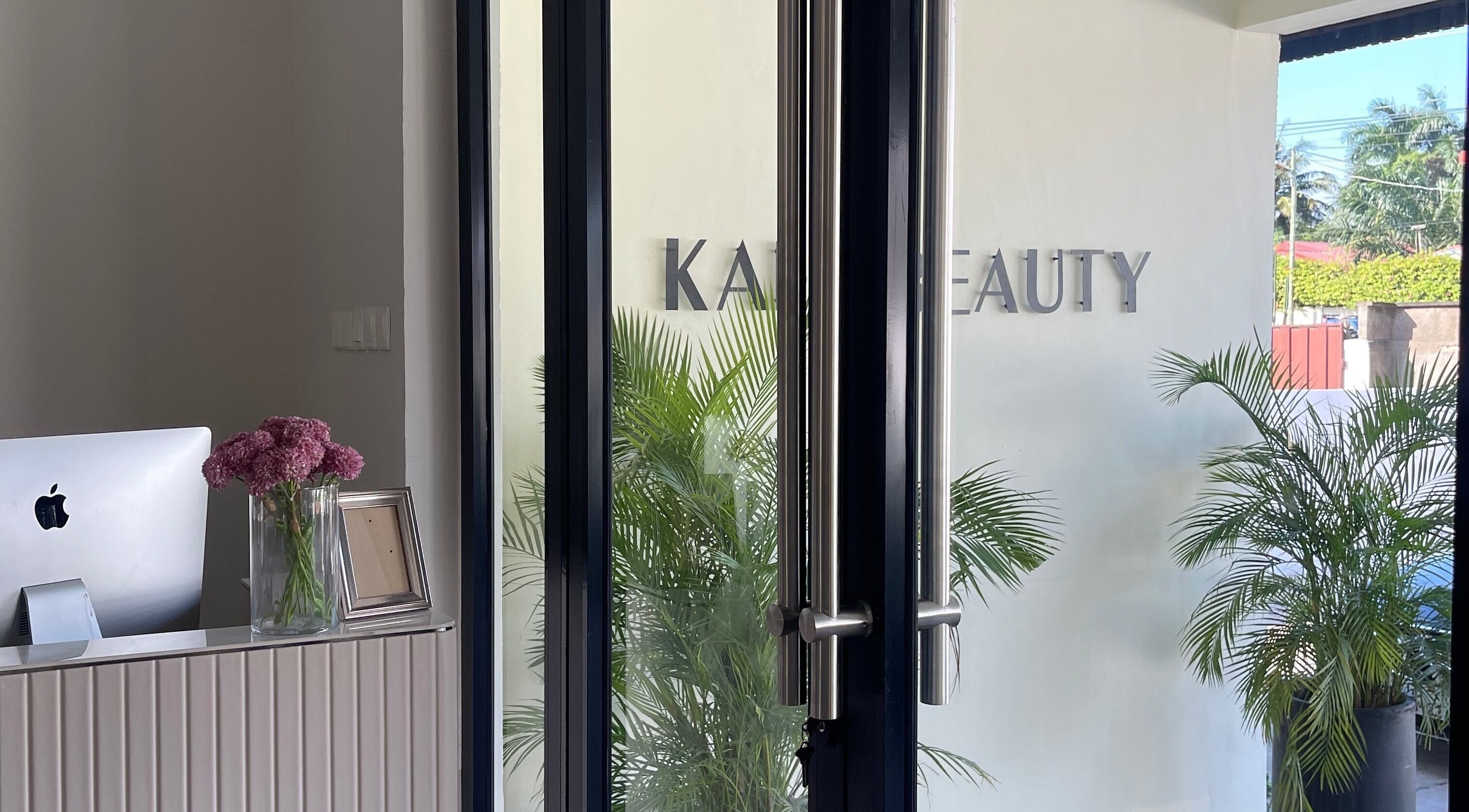 Entrance to Kai Beauty Studio in Accra, Greater Accra Region, GH with lush plants and a welcoming decor.