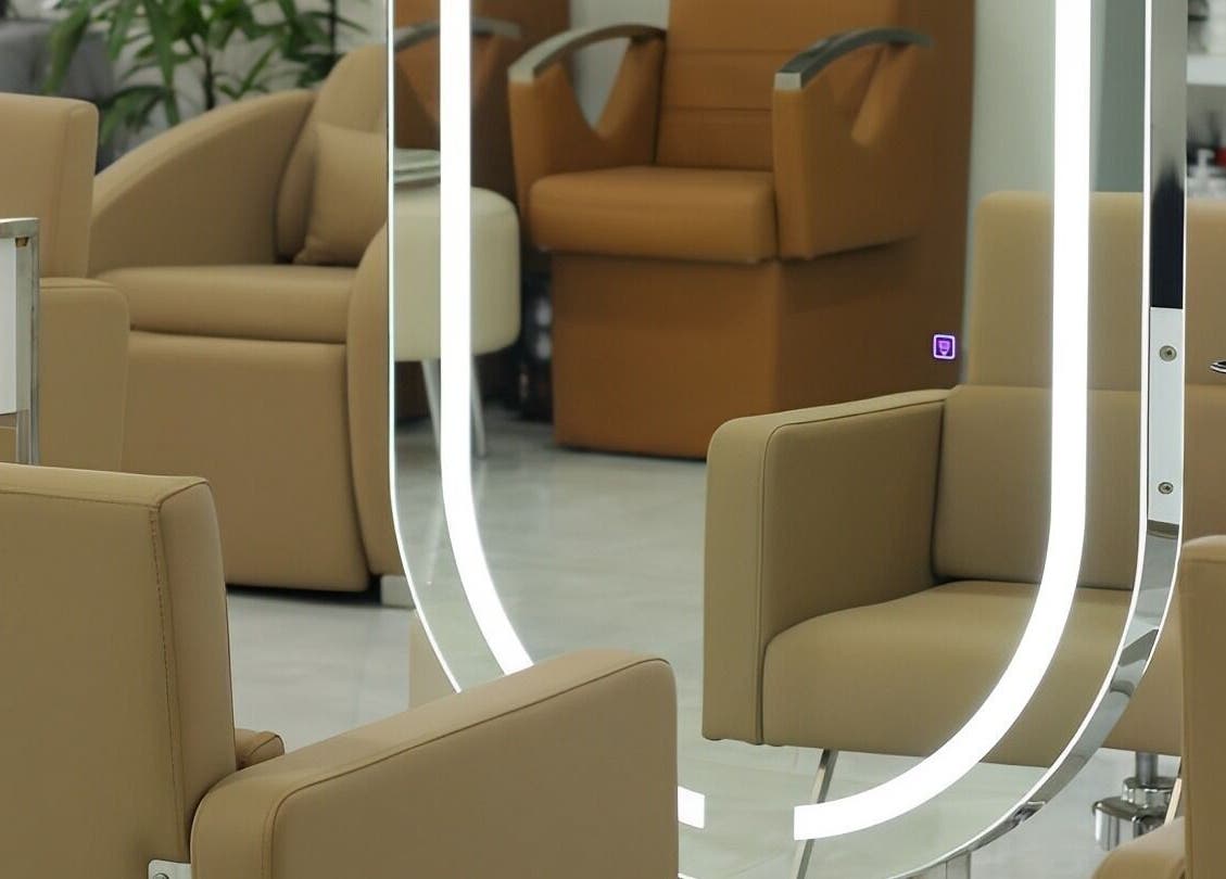 Elegant salon seating at Kai Beauty Studio, Accra, Greater Accra Region, GH, with stylish mirrors and plush chairs.