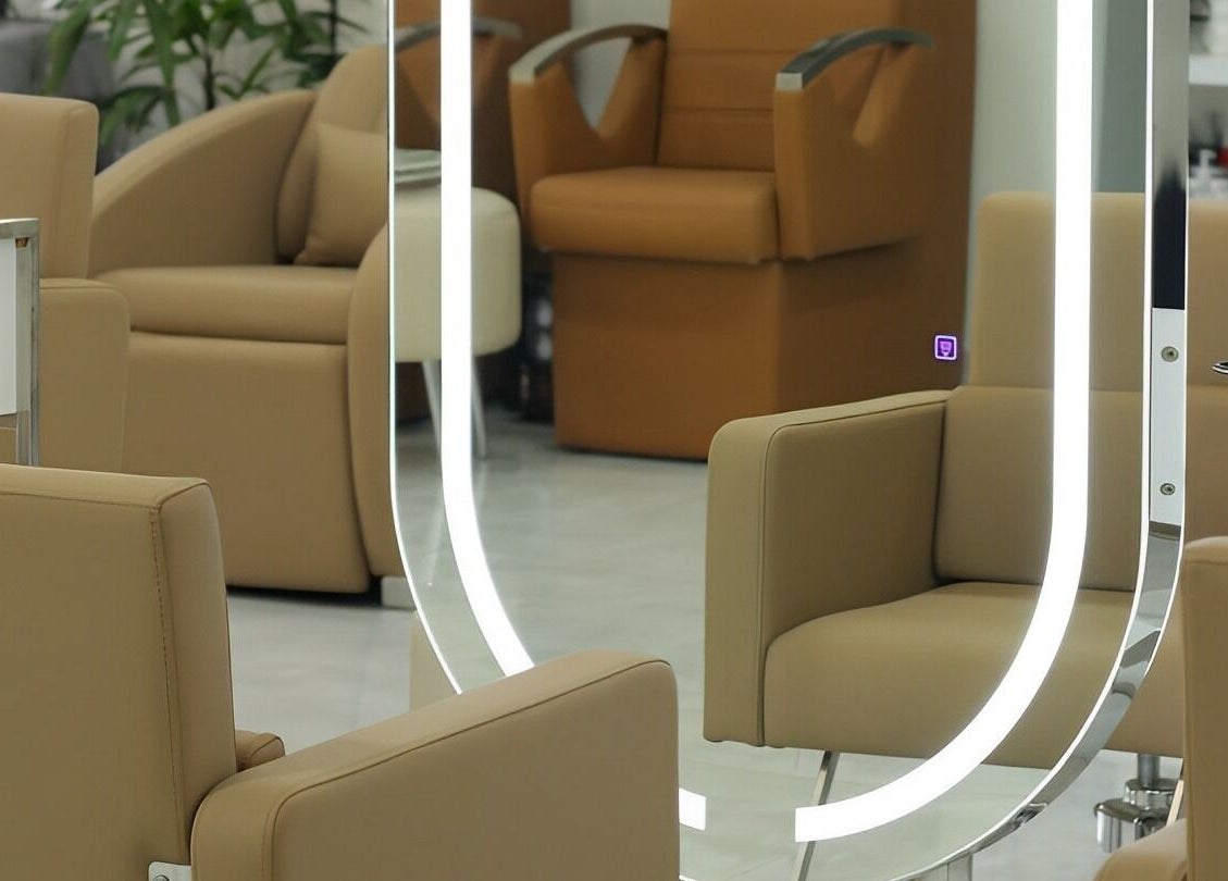 Elegant salon seating at Kai Beauty Studio, Accra, Greater Accra Region, GH, with stylish mirrors and plush chairs.
