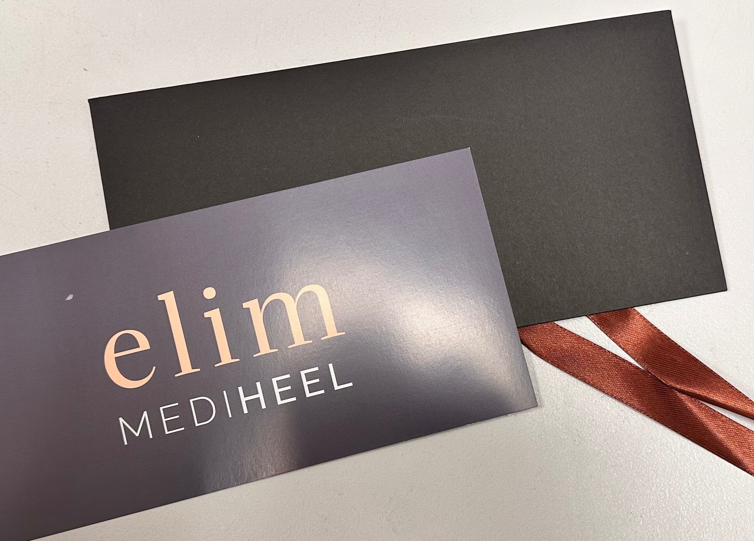 Elegant Elim Mediheel gift card at KL Nail Studio, Newtown, Wales, GB, with black envelope and ribbon.