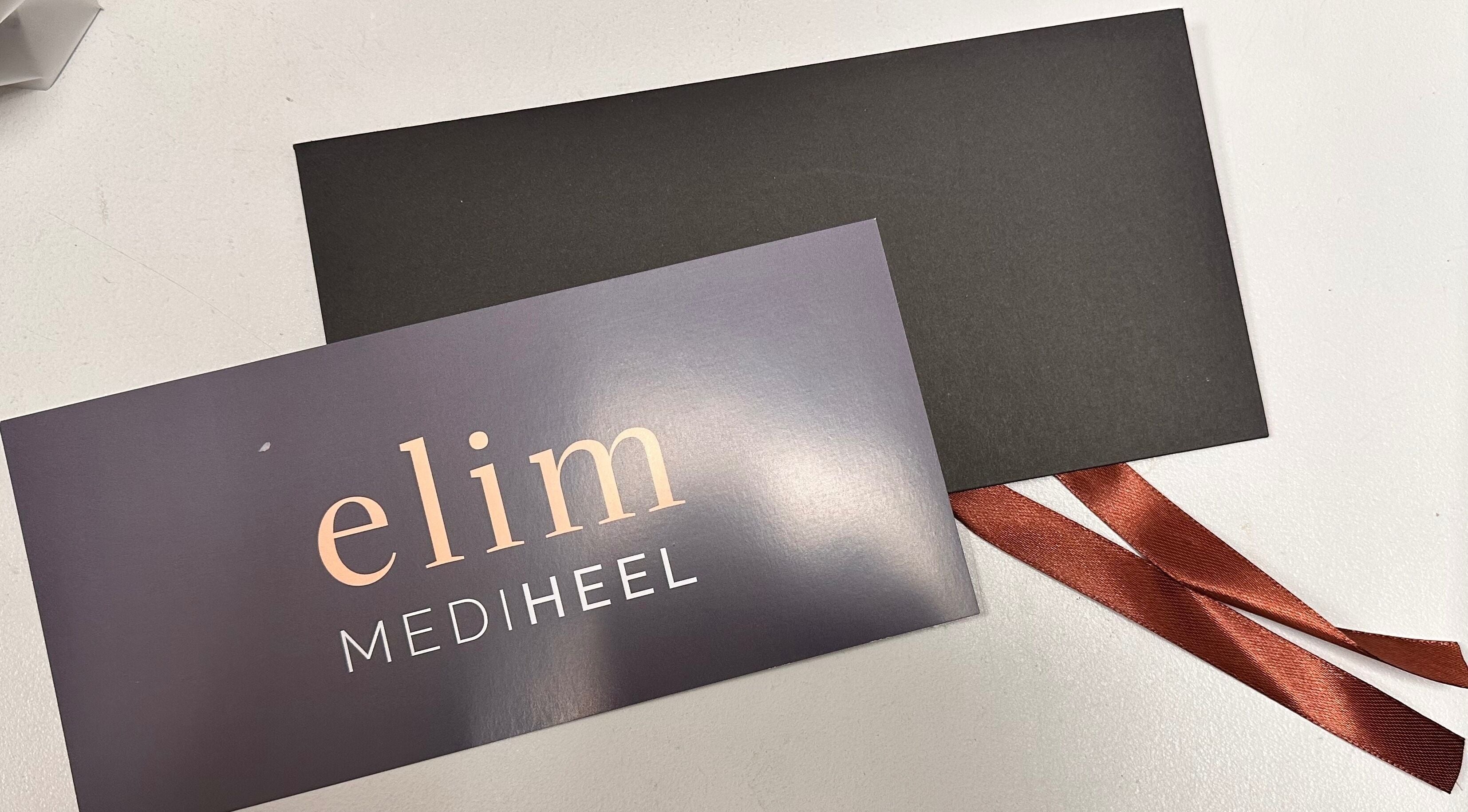 Elegant Elim Mediheel gift card at KL Nail Studio, Newtown, Wales, GB, with black envelope and ribbon.