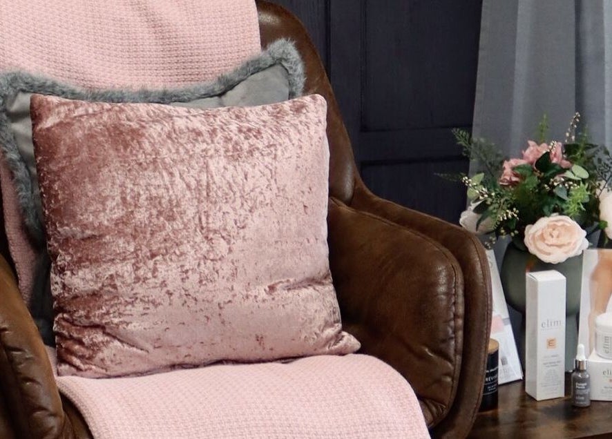 KL Nail Studio in Newtown, Wales, GB offers a cozy chair with pink accents and beauty products.