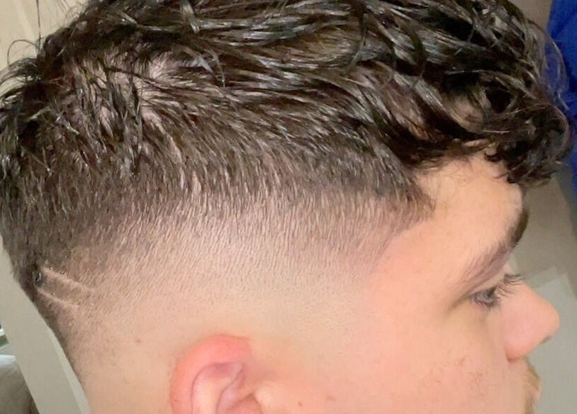 Close-up of a trendy haircut with a fade at L’s House Of Hair, Kibworth Harcourt, England, GB.
