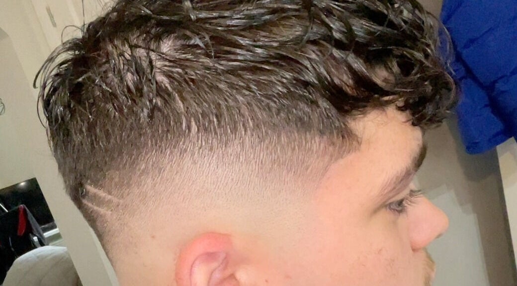 Close-up of a trendy haircut with a fade at L’s House Of Hair, Kibworth Harcourt, England, GB.