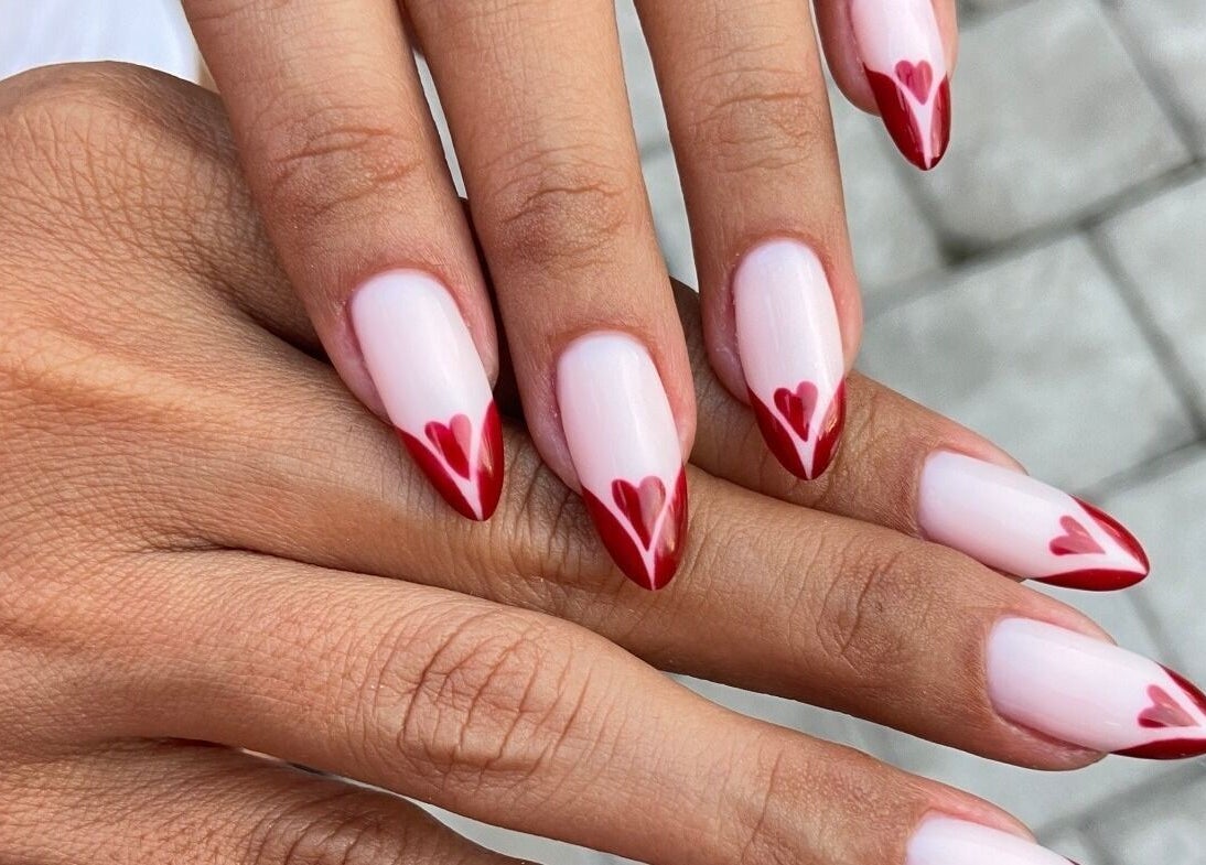 Chic heart-tipped manicure at Cutie Pai Nails, Bali, Bali, ID. Perfectly styled for elegant nail art lovers.