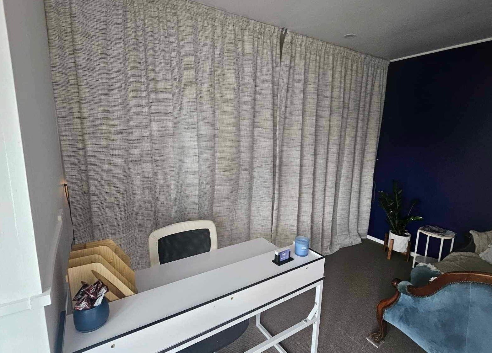 Relaxing room at Whaitere Ora, Gisborne, NZ, highlighting cozy seating and tranquil decor.