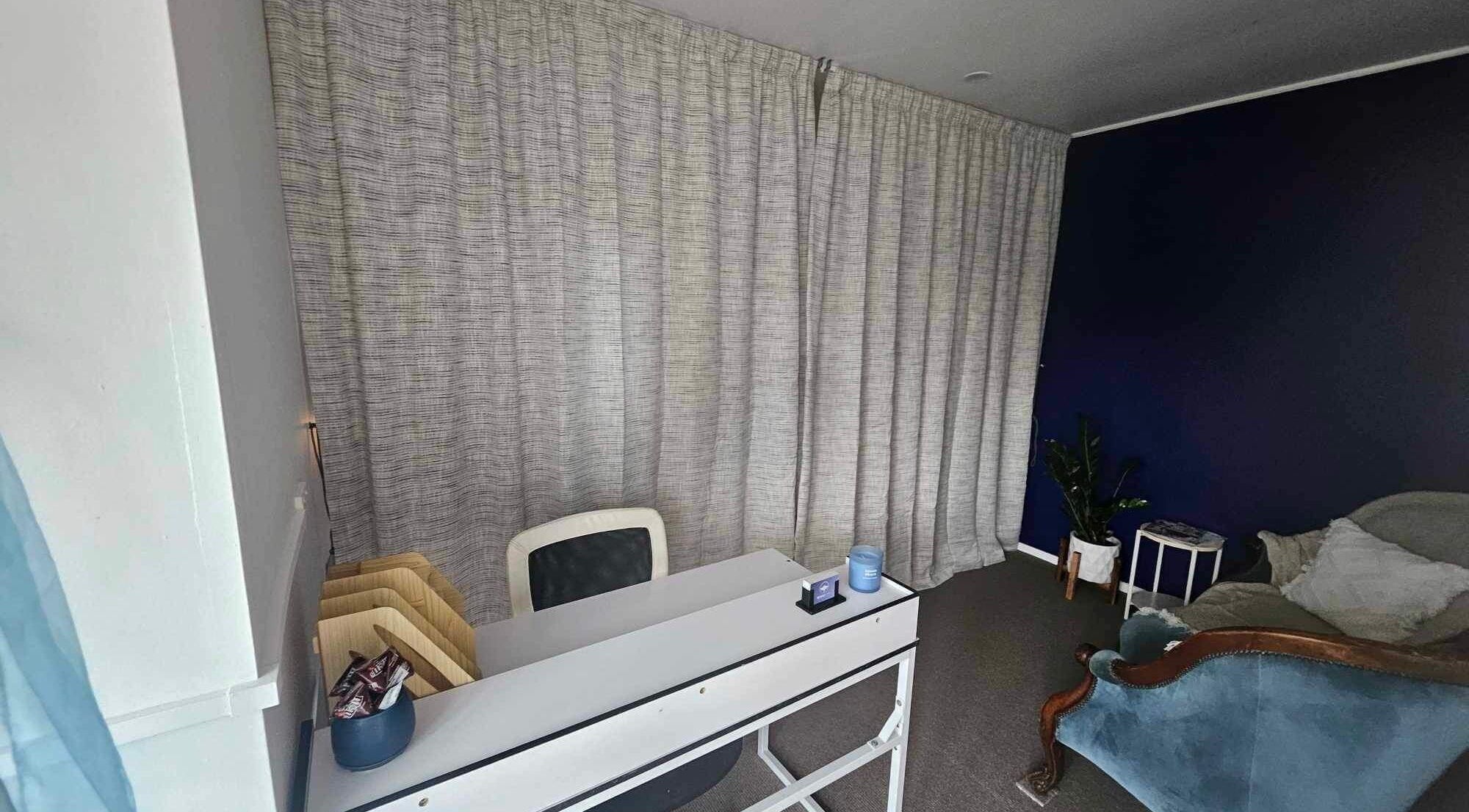 Relaxing room at Whaitere Ora, Gisborne, NZ, highlighting cozy seating and tranquil decor.