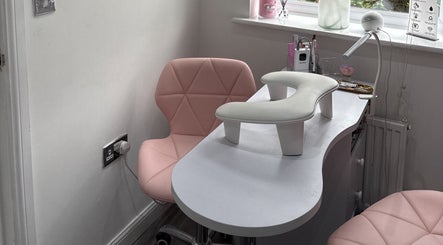 Elegant nail station at Ella Louise Beautyy in Rochdale, England, GB featuring pink chairs and nail tools.