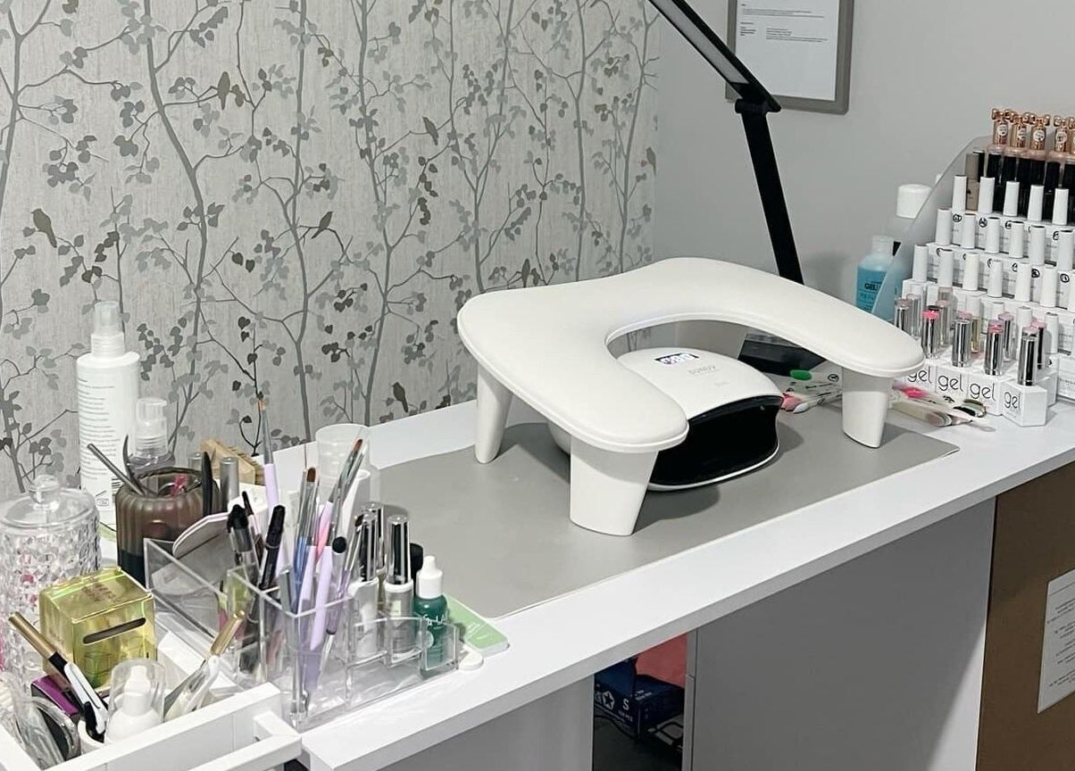 YG Beauty nail station with tools and polish in Middlesbrough, GB offering professional nail care services.