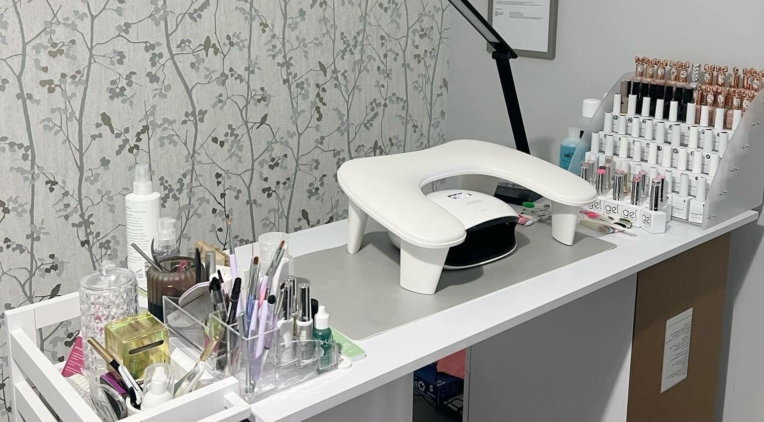 YG Beauty nail station with tools and polish in Middlesbrough, GB offering professional nail care services.