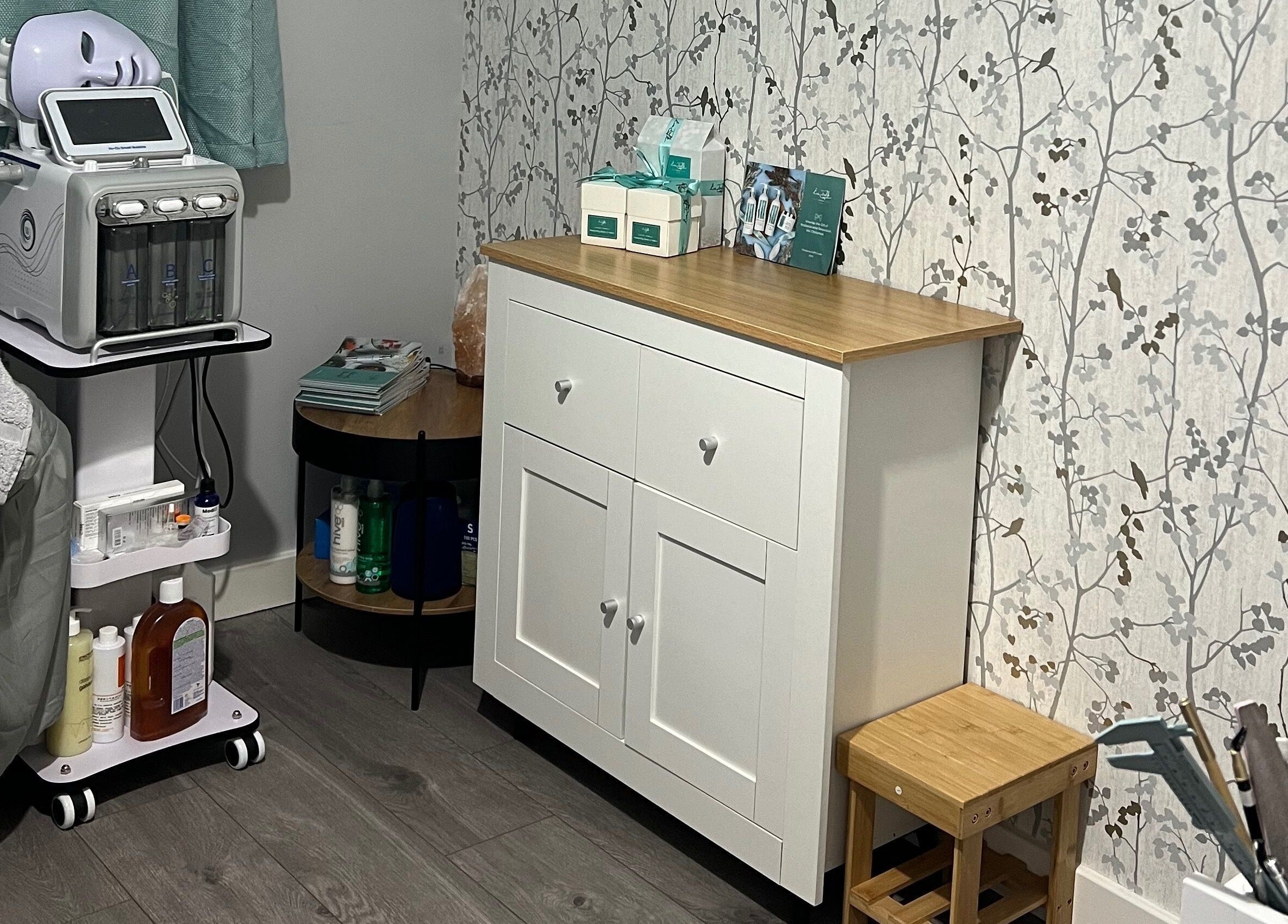 Cozy skincare room at YG Beauty, Middlesbrough, GB, featuring modern equipment and serene wallpaper.