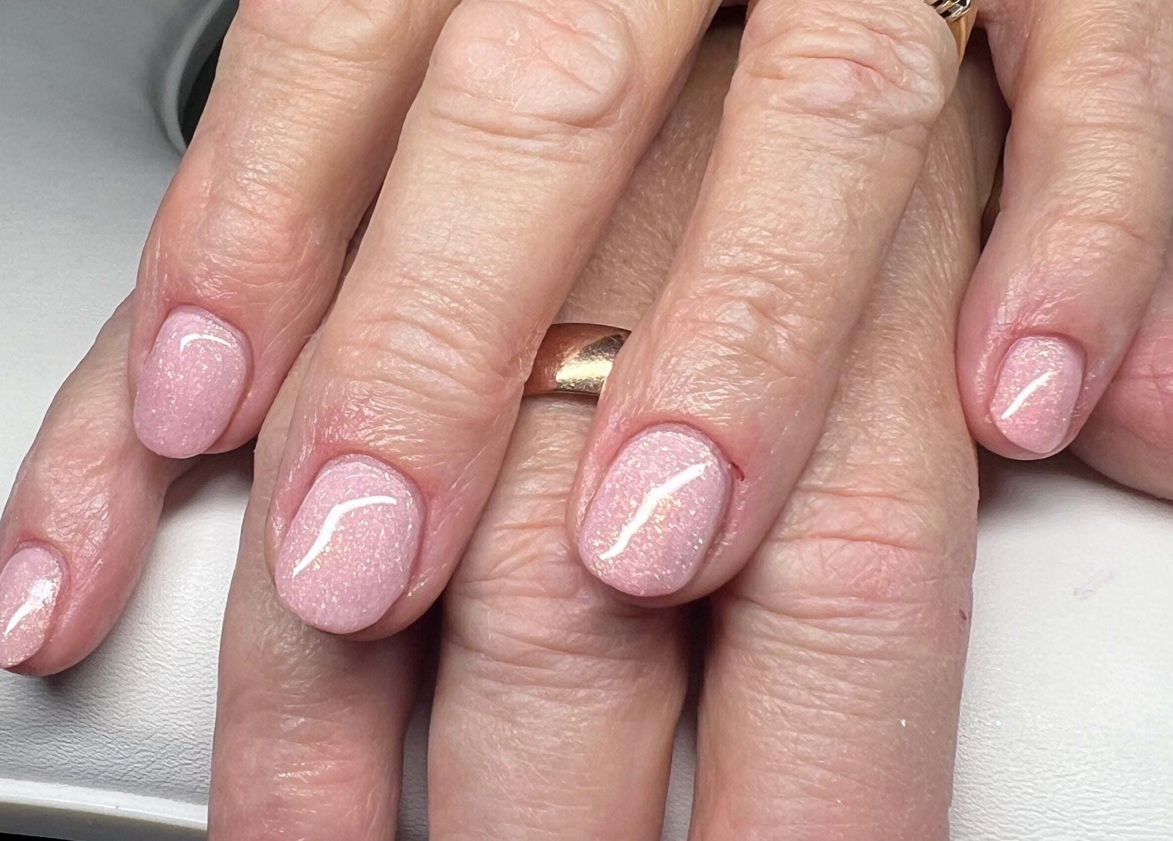 Elegant pink nails manicure at YG Beauty, Middlesbrough, GB, showcasing glossy finish and nail care.
