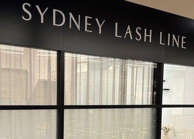 Front view of Sophie Humphries Makeup - Rosebery, showcasing elegant glass facade in Rosebery, New South Wales, AU.