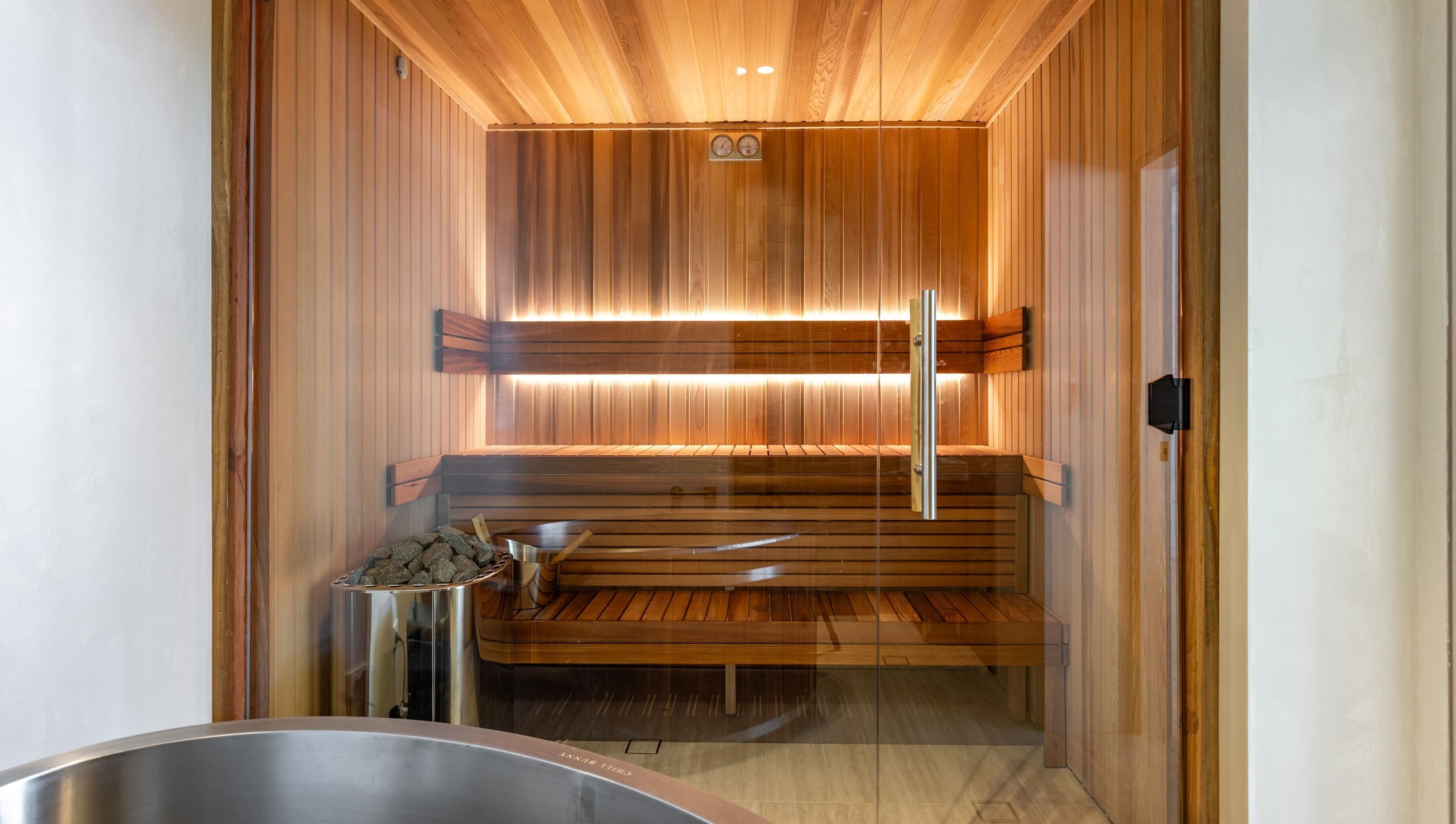 Luxurious sauna room at Elite Body Recovery and Wellbeing in Maroubra, New South Wales, AU, featuring warm wooden interiors.
