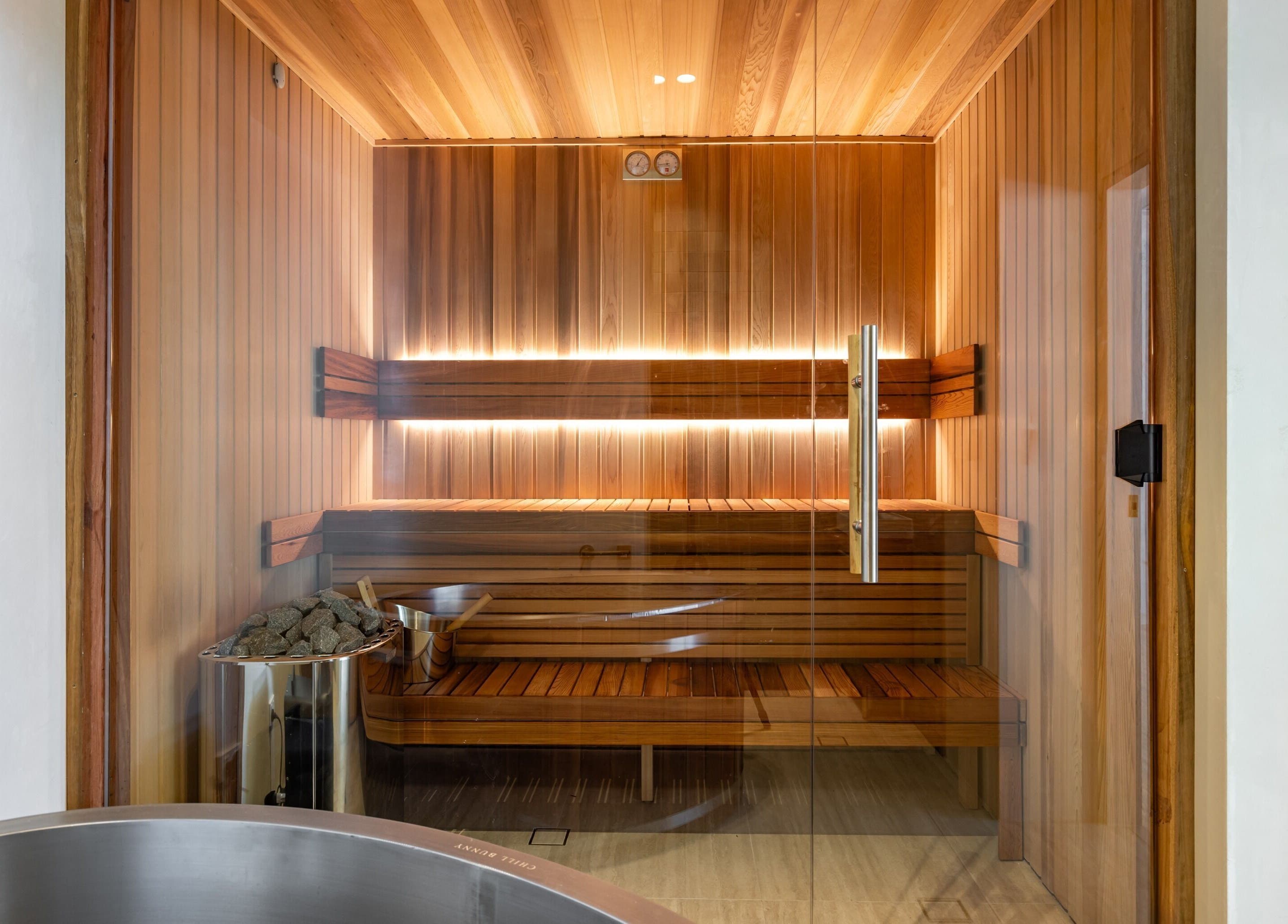 Luxurious sauna room at Elite Body Recovery and Wellbeing in Maroubra, New South Wales, AU, featuring warm wooden interiors.