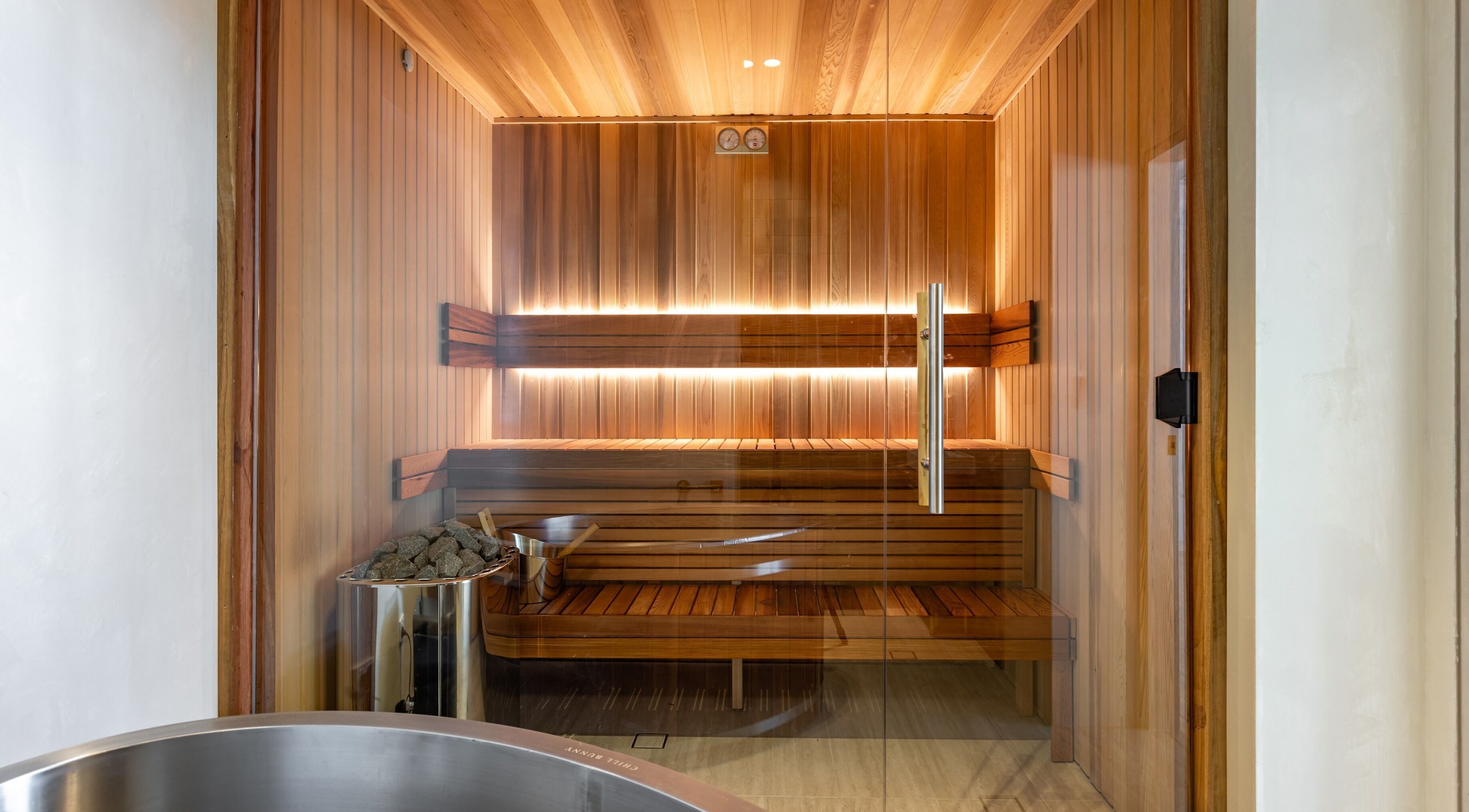 Luxurious sauna room at Elite Body Recovery and Wellbeing in Maroubra, New South Wales, AU, featuring warm wooden interiors.