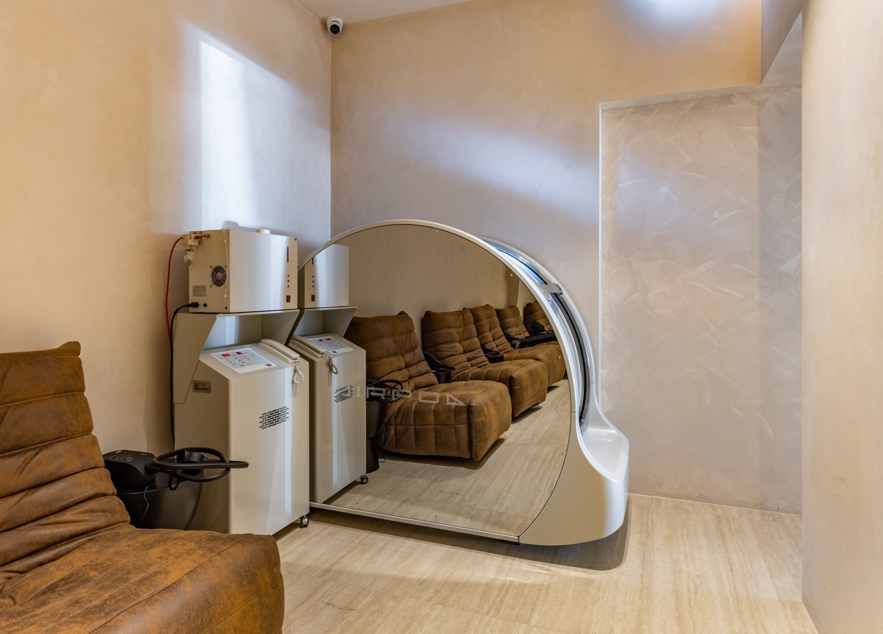 Relaxing lounge at Elite Body Recovery and Wellbeing, Maroubra, New South Wales, AU with plush seating and sleek design.