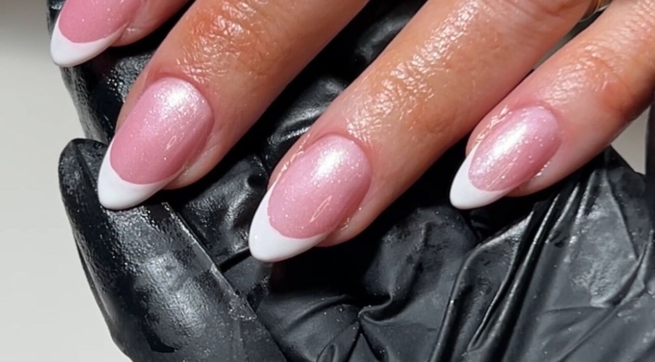 Stylish pink French manicure at Natasha’s Nails, Cornwallis, New South Wales, AU, showcasing classic nail art.