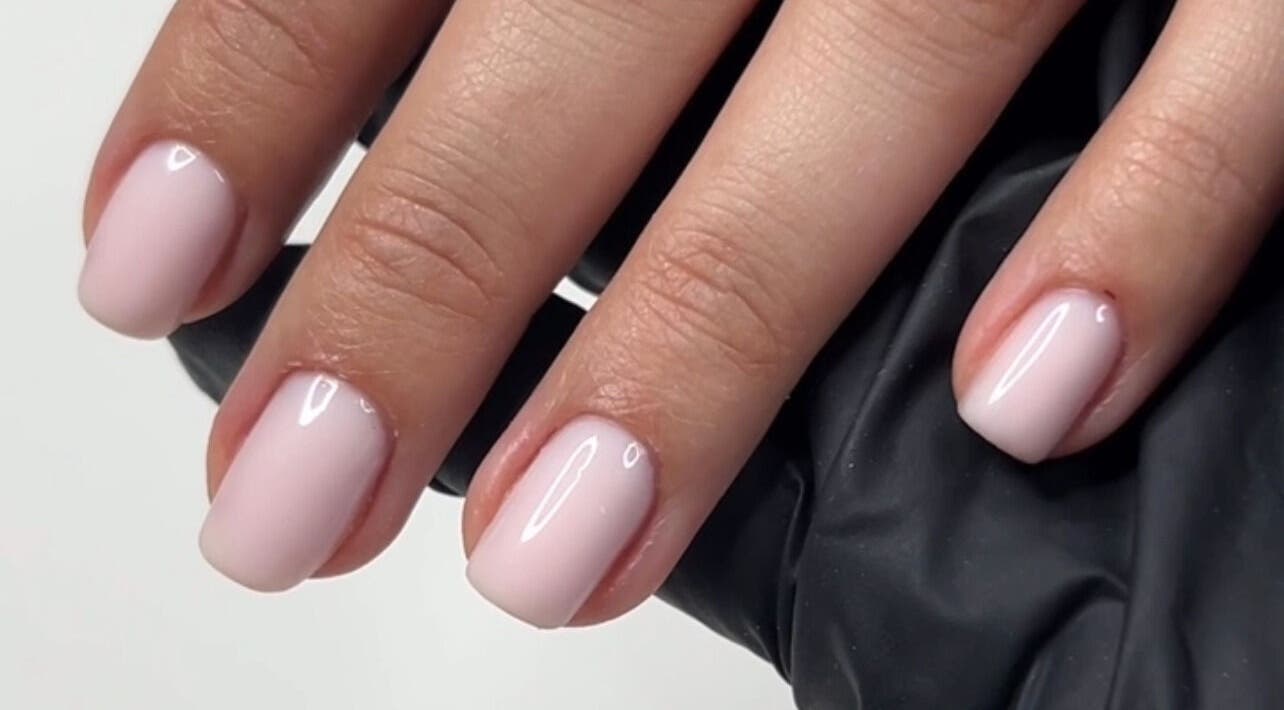 Stylish manicure at Natasha’s Nails, Cornwallis, New South Wales, AU, showcasing glossy soft pink nails.