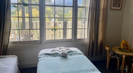 Tranquil massage room at Holistic Massage and Facial for Women, Healesville, Victoria, AU with nature view.