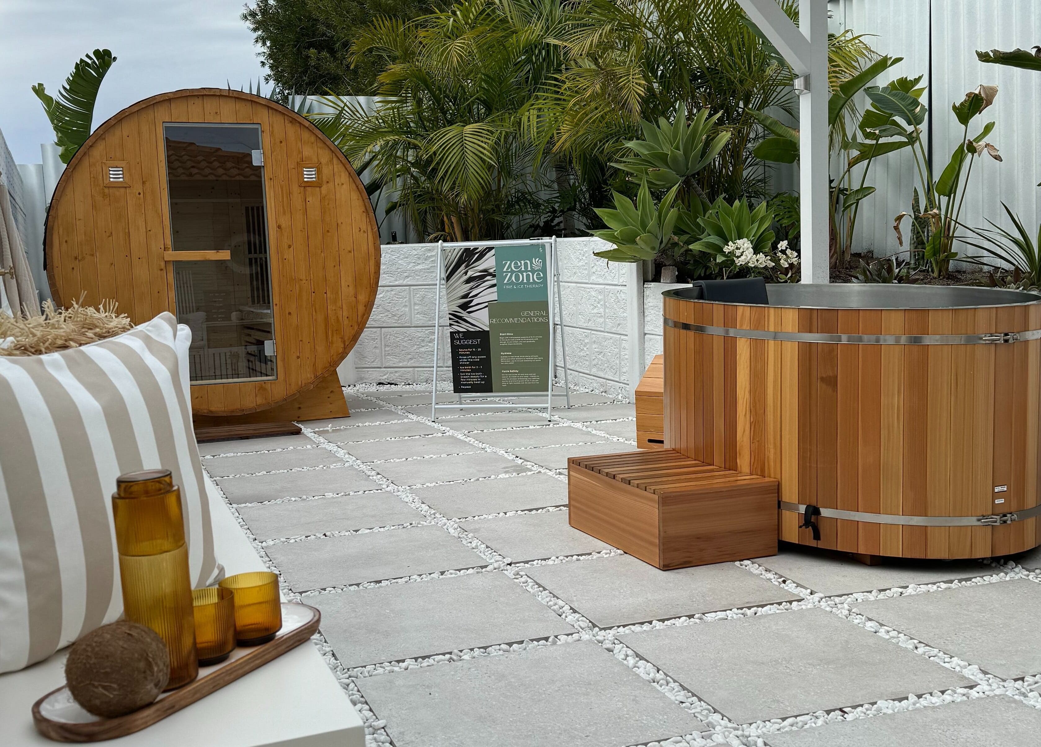 Outdoor spa area at Zen Zone Perth, Beldon, Western Australia, AU, with a barrel sauna and hot tub.