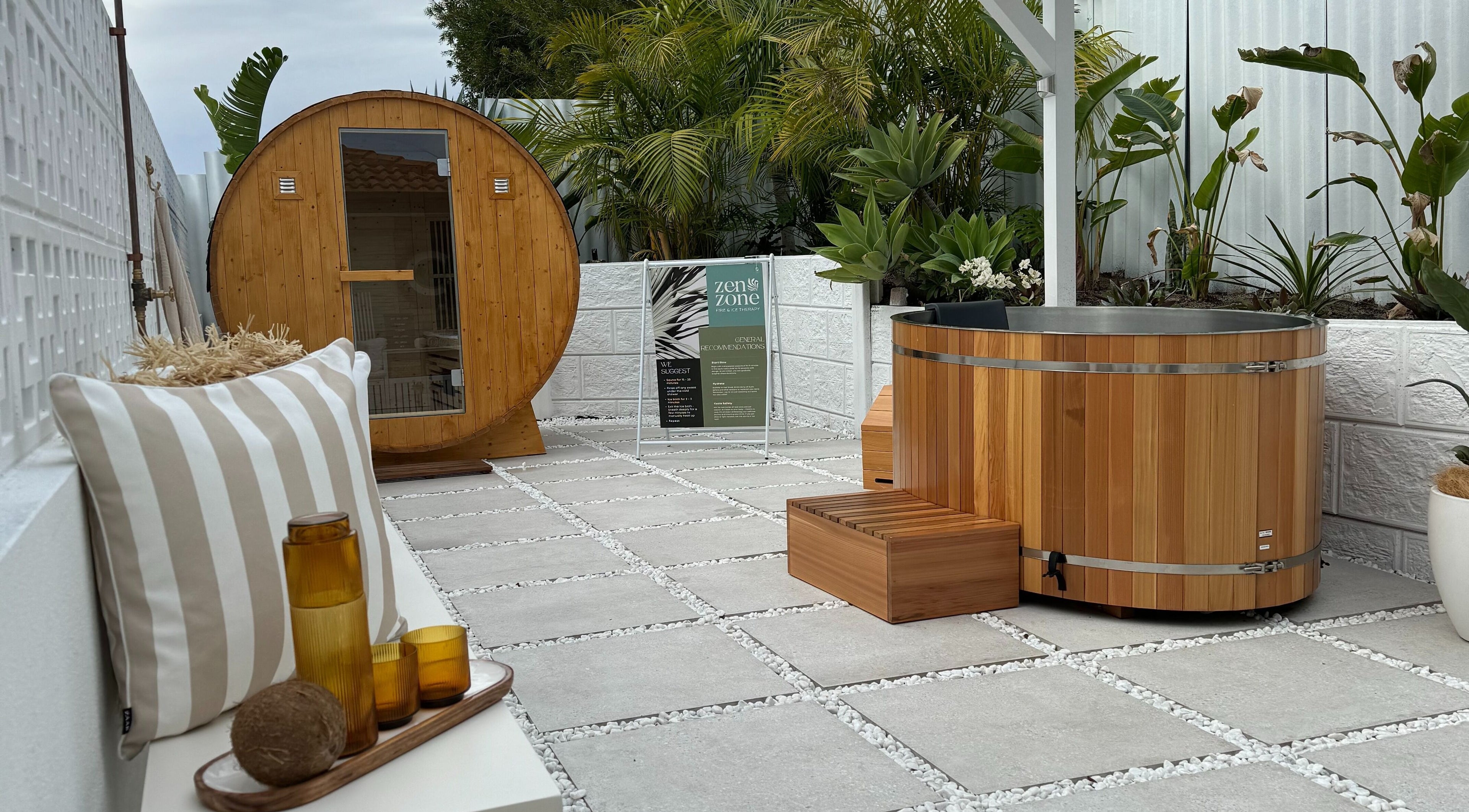 Outdoor spa area at Zen Zone Perth, Beldon, Western Australia, AU, with a barrel sauna and hot tub.