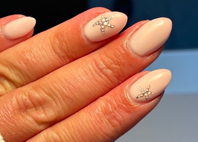 Elegant pink nails with star accents at BIABI Nails & Beauty, Glasgow, Scotland, GB.