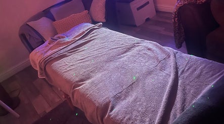 Cozy massage setup at Relax and Renew - Mobile Massage Service in Bolton, England, GB with ambient lighting.