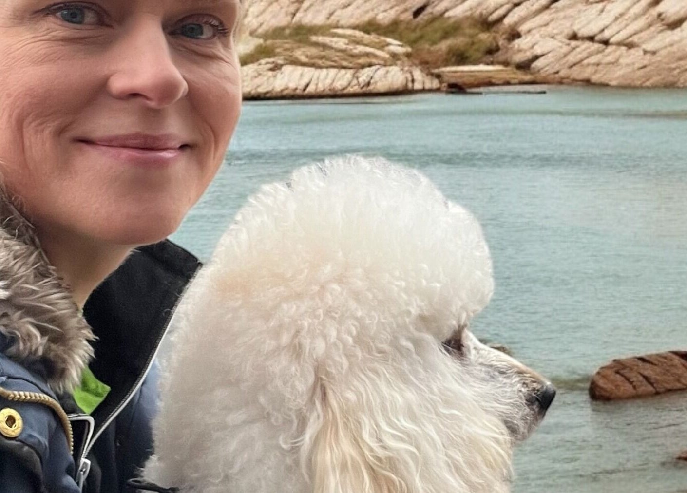 Woman with poodle at Hönö Hundfrisör by the sea, Hönö, Västra Götalands Län, SE.